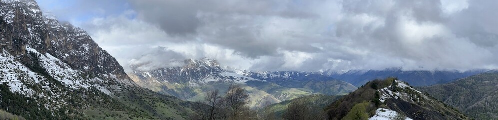 Tseylomsky pass in Ingushetia. A trip uphill to the Tsei Loam pass on a cloudy spring day. Panorama...