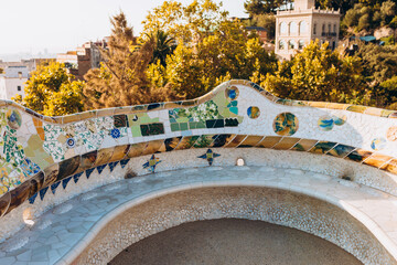 Serpent bench made of mosaic tiles in Park Guell in Barcelona. UNESCO World Heritage Site. Concept...