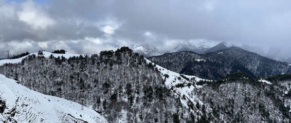 Tseylomsky pass in Ingushetia. A trip uphill to the Tsei Loam pass on a cloudy spring day. Panorama...