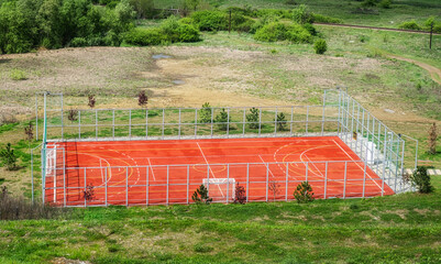 Empty Sports Field For Outdoor Sports Activities fenced