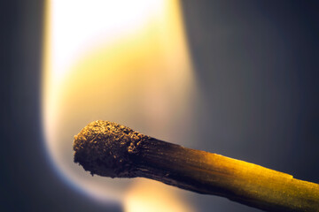 burning match close-up, yellow fire, warmth, heating, comfort, mysterious, macro