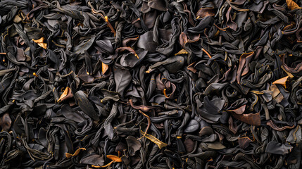 Black Darjeeling tea dried leaves background and texture