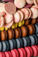 Close-up of multi-colored macaroons neatly arranged in rows