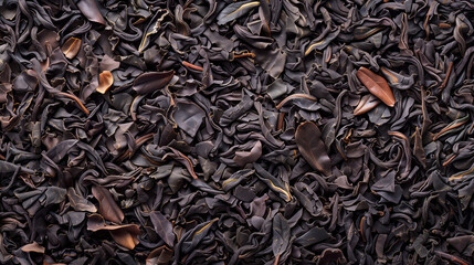 Black Darjeeling tea dried leaves background and texture