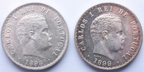 two different Portuguese silver coins with the portrait of King Carlos I and the year of minting