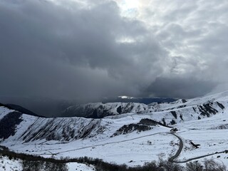 Tseylomsky pass in Ingushetia. A trip uphill to the Tsei Loam pass on a cloudy spring day. Panorama...