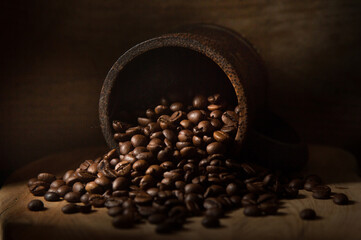 coffee beans in a wooden cup on the table.