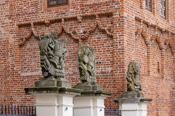 Sculptures above the entrance gate to medieval Ducal Castle (Szczecin Castle), Szczecin, Poland - obrazy, fototapety, plakaty