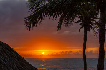 Fototapeta na wymiar Superb sunrise on a pretty beach in Punta Cana in the Dominican Republic