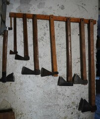 An old ax with a long handle. Collection of old axes