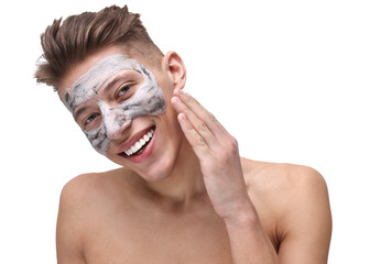 Handsome man with clay mask on his face against white background