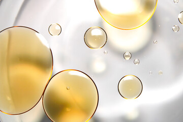Close-up of oil droplets floating on water.