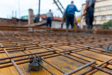 Web of metal rebar or armature steel  on the construction site, concrete plate is about to be made, steel rebar for support and strength. Reinforced concrete iron on the construction site - obrazy, fototapety, plakaty