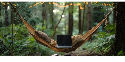 A hammock with a laptop for enjoyment working on hammock outside the house , Tranquil hammock in a lush garden with twinkling lights
