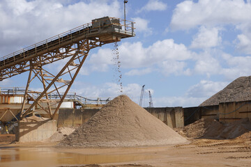Sand conveyor at aggregates site. industrial machinery and materials for construction 