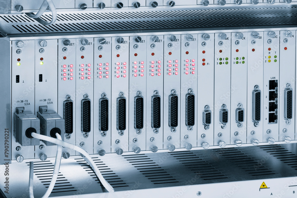 Poster A row of computer cables with a clock on the left side.