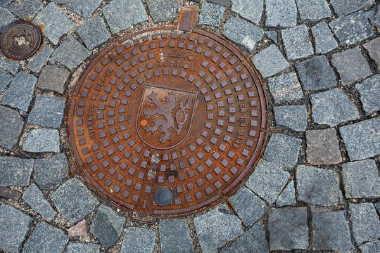 Czech Republic, Turnov - July 2 2013: unique sewer hatch with the coat of arms, urban detail