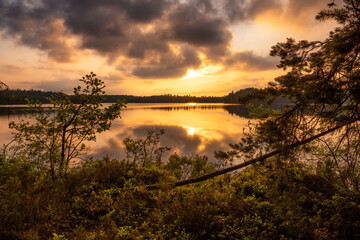 Sunset framed by a lake
