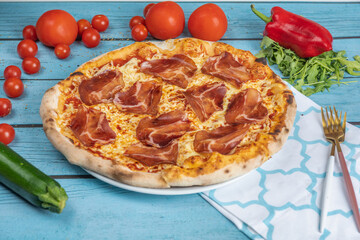 pizza with tomatoes and cheese