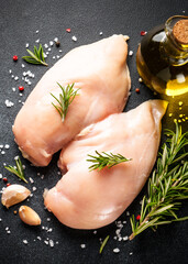Chicken meat. Raw chicken breast with herb and spices at black background. Top view. - 790810263