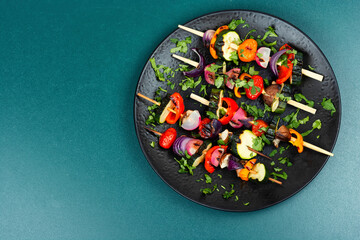 Grilled vegetables on skewers, copy space.