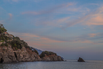 Seaside Sunset Over Rolling Hills