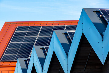 Solar panels on roofs. A striking image with selective focus on the nearest panel. An abundance of...