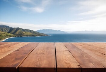 Wooden deck overlooking a scenic ocean view with mountains in the background