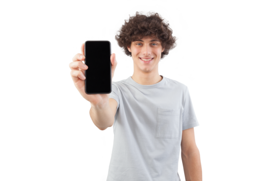 Smiling and handsome, the young man showing the blank screen of his smartphone to the camera, while looking into the camera with his blue eyes, isolated against a white background - Powered by Adobe