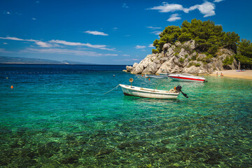 Beautiful beach and moored boats on the Adriatic Sea, Croatia