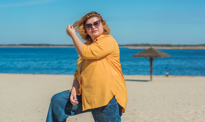 Pretty American middle age woman in vacation or at city. Size plus and xxl woman. Life of plump people in everyday life, faith in herself. Concept of life modern woman