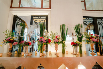 Elegant wedding arch with fresh flowers