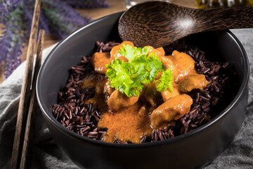 Thai red curry with chicken and black rice.