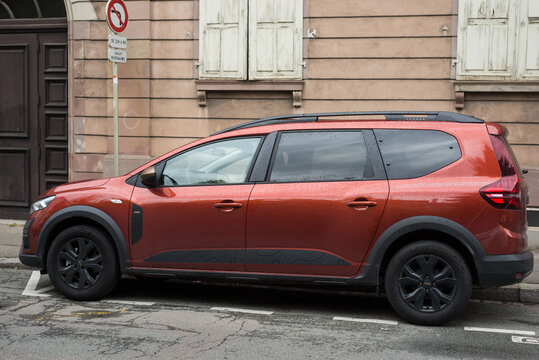 Mulhouse - France - 21 April 2024 - Profile view of orange Dacia jogger parked in the street
