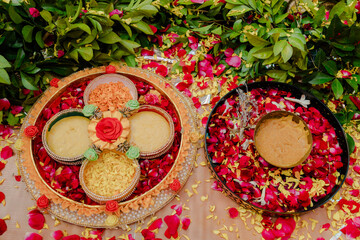 Traditional puja thali - plate for the ritual ceremony with kumkum, haldi or turmeric powder,...