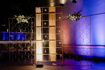 decoration of a wedding ceremony with original details and candles.