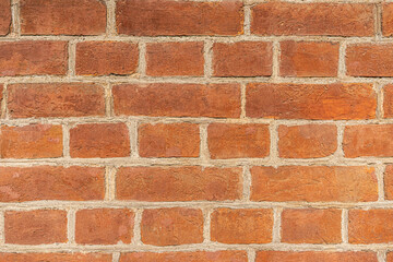 Empty brick red wall. background of a old brick house.