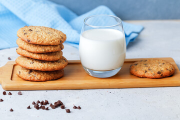 Oats Cookies With Chocolate Drops, Honey And Glass Of Milk. Side View On Grey Background.
