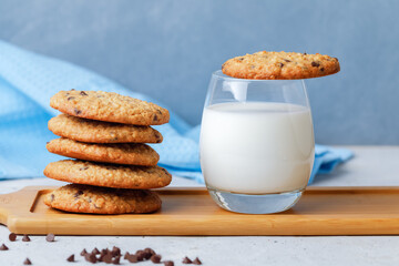 Oats Cookies With Chocolate Drops, Honey And Glass Of Milk. Side View On Grey Background.