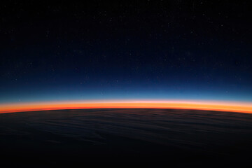 The horizon line, a thin strip of dark blue and red sky at the edge of space - Powered by Adobe