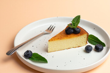 Cheesecake Slice On Plate With Blueberries, Pink Background. Trendy Fashion Dessert
