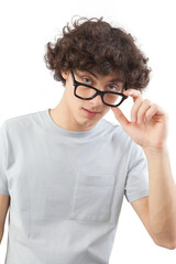 Smiling and handsome, the young man wears glasses. He looks into the camera with his blue eyes, man portrait with eyeglasses isolated against a white background