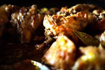 delicious homemade fried meat in a pan, closeup