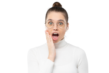 Surprised girl wearing glasses and white sweater, looking at camera with mouth open in shock