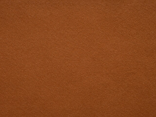 Rich cinnamon felt texture, invoking warmth and comfort with its earth-toned, inviting tactile presence