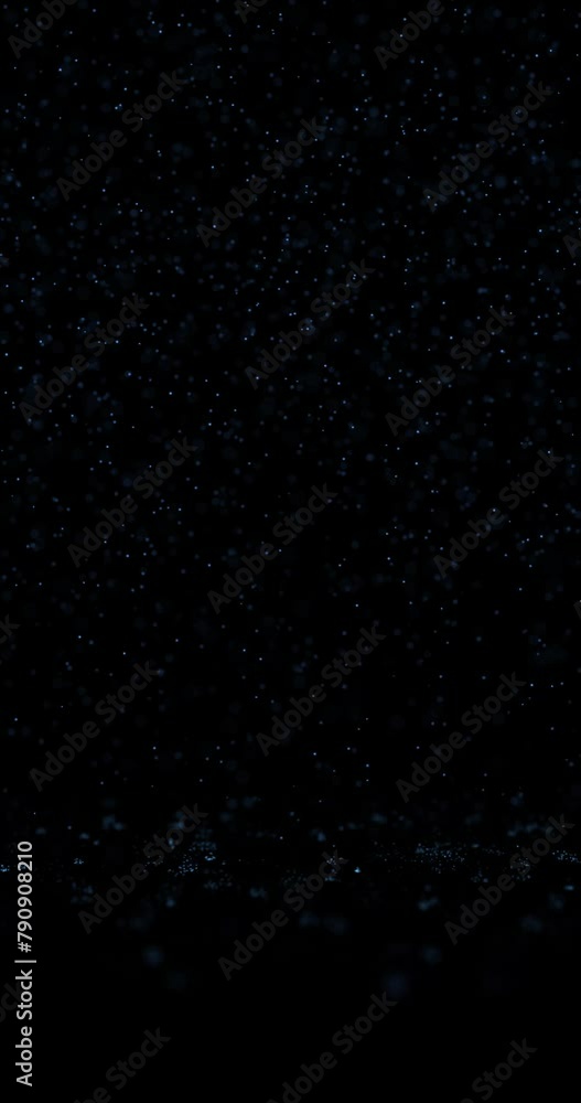 Poster rainfall rain drops closeup bouncing seamless looping on clean black copy space vertical background.