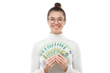 Young happy smiling female in glasses and white turtleneck sweater holding fan of hundred 100 euro banknotes in front of her
