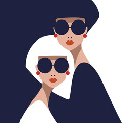two women  in sunglasses