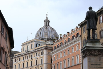 Fototapeta premium Corso Vittorio Emanuele II Street Building Facades with Church Dome and Statue in Rome, Italy