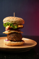 Burger served on a wooden plate with lettuce, onion, tomato, poached egg, big patty, social media post, food photography, fine dining, restaurant menu, fast food, junk food, street food, delicious